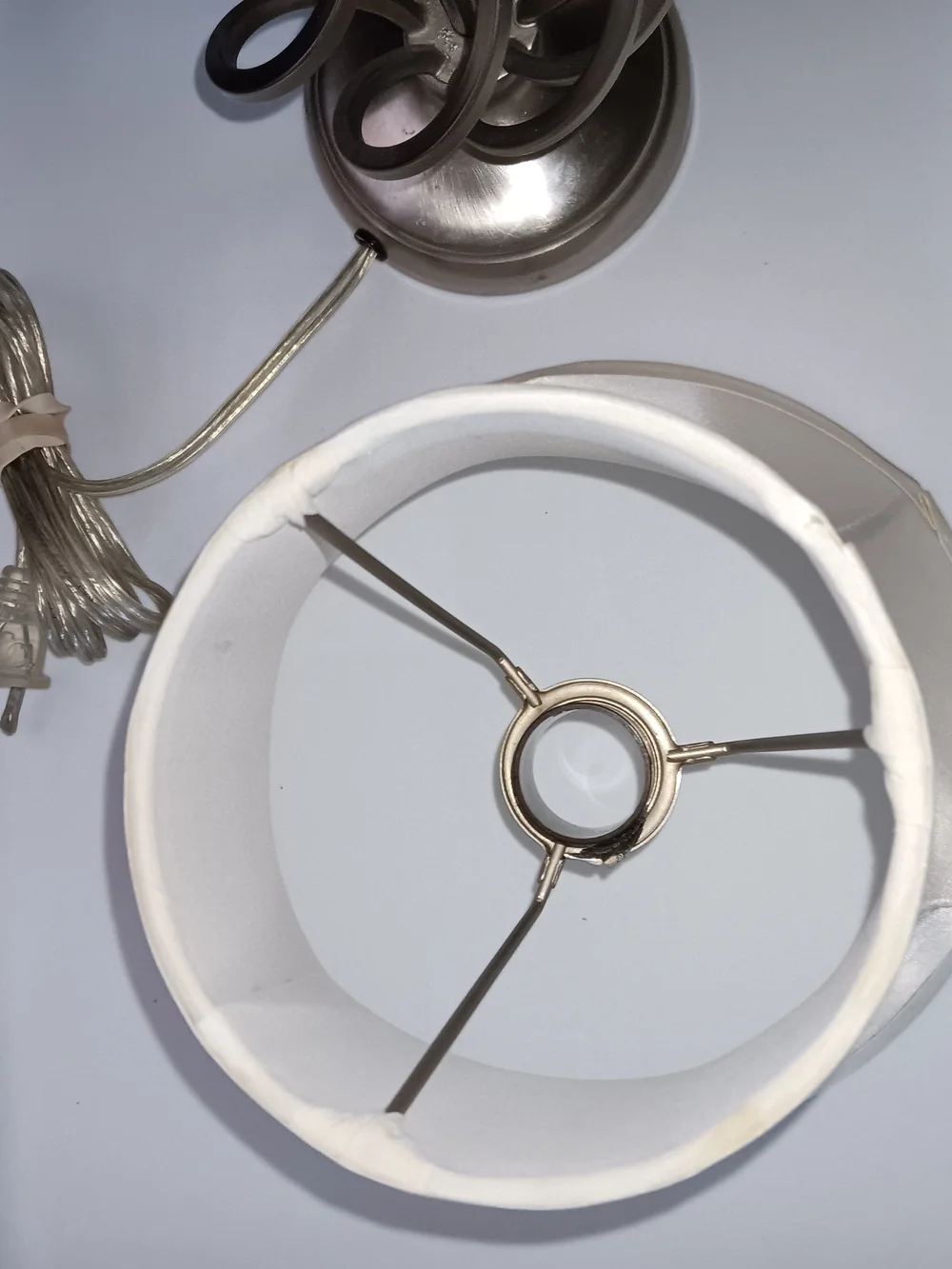 White and Silver Table Lamp with Curved Metal Base